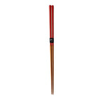 Pair of red and wooden chopsticks on a white background