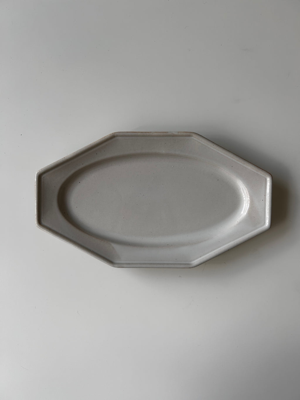 Octagonal ceramic plate on a plain background