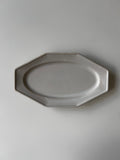 Octagonal ceramic plate on a plain background